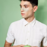 man-looking-away-holding-apple_23-2148364752