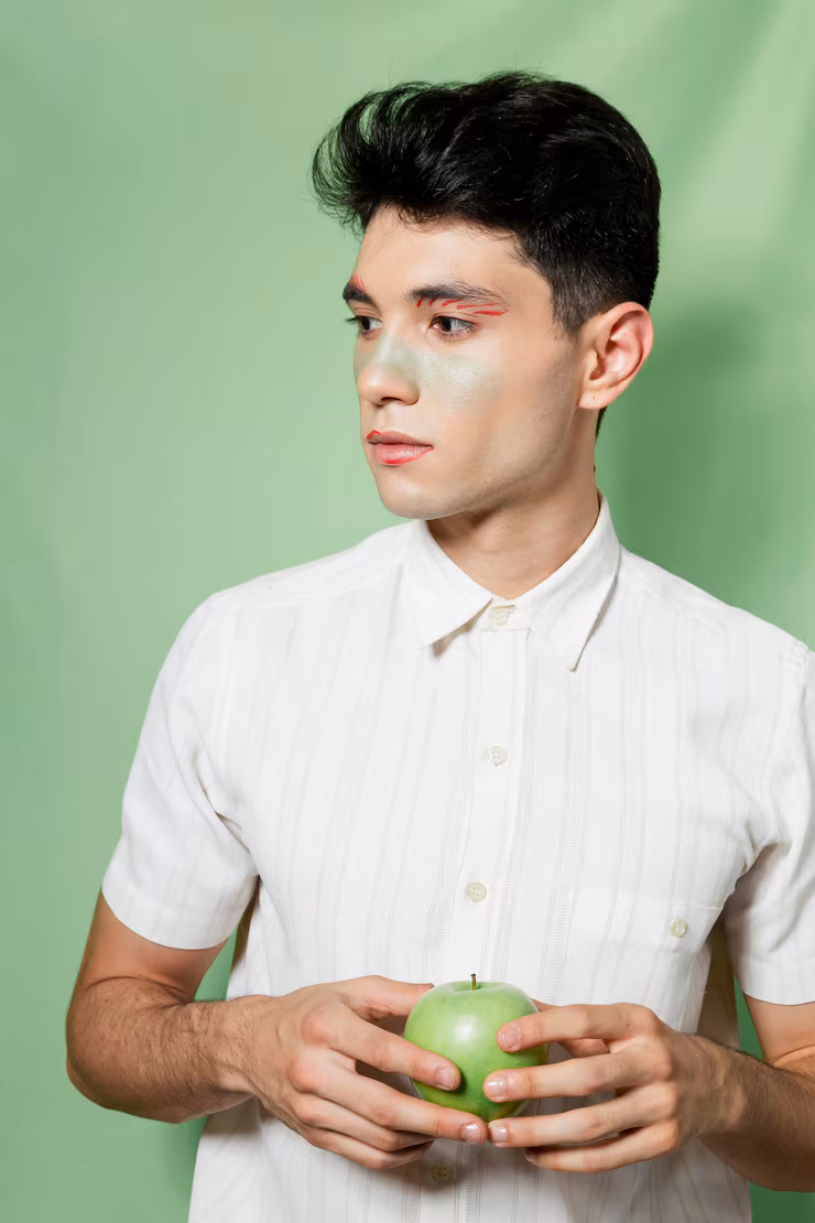 man-looking-away-holding-apple_23-2148364752